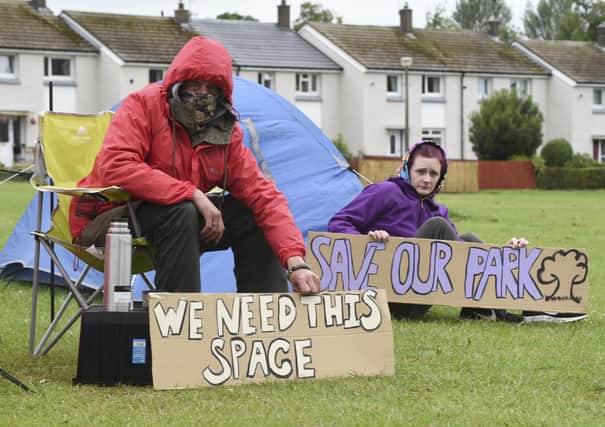 Local residents camped out on the green for days to protest the site investigations. Picture: Lisa Ferguson




residents George and Sue are camping out in the park along with other residents



Moredun residents campaign to save thier park from developers who want to build flats on site