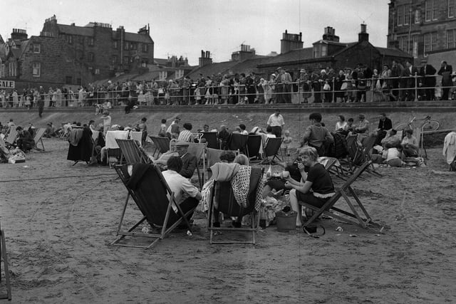 Walkers on the Promenade look down at the sunbathers on Portobello Beach in July 1961.