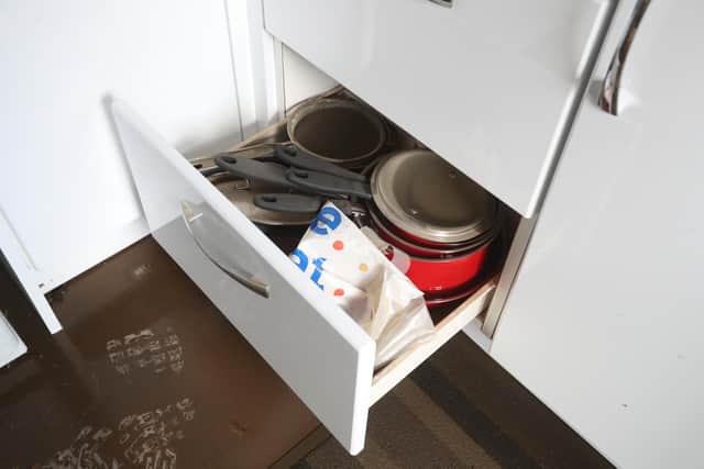 A drawer in Jean Hendrie and William Craik's house in Pyothall Court in Broxburn, West Lothian after flooding.