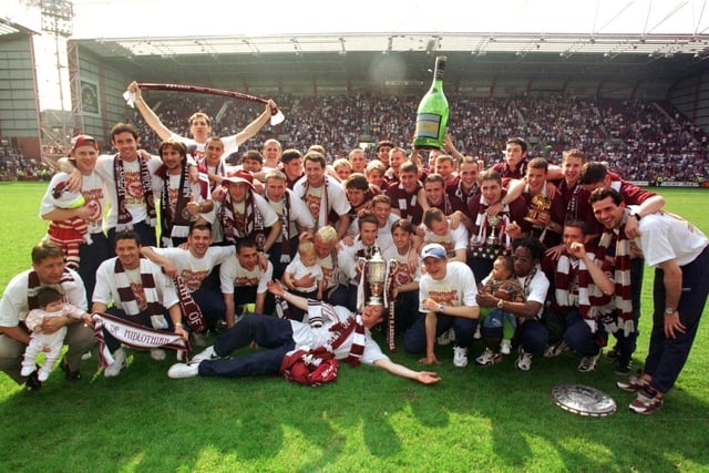 Hearts acknowledge all their fans after showing off the Scottish Cup on a glorious sunday at Tynecastle Park in 1998.  Included in the celebrations are the Hearts BP Youth Cup winners too.