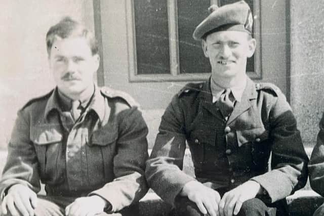 Major John Errington (left), during his time as a prisoner of war in 1942. Photo: PA.