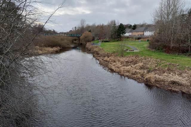The River Almond at Howden, Livingston looking towards the shopping complex.
