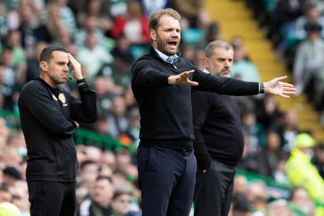 The technical area at Celtic Park as Robbie Neilson issues instructions.