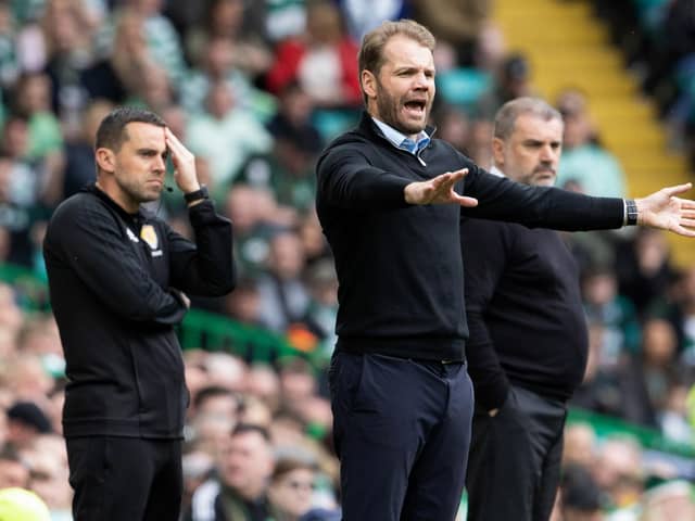 The technical area at Celtic Park as Robbie Neilson issues instructions.