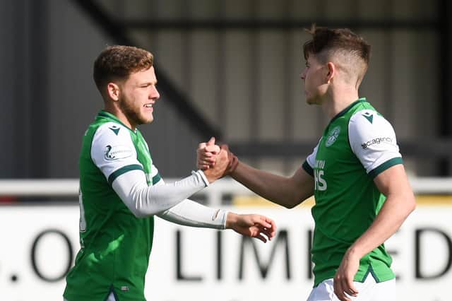 Jamie Gullan is congratulated by fellow goalscorer Kevin Nisbet after his goal against Cove Rangers