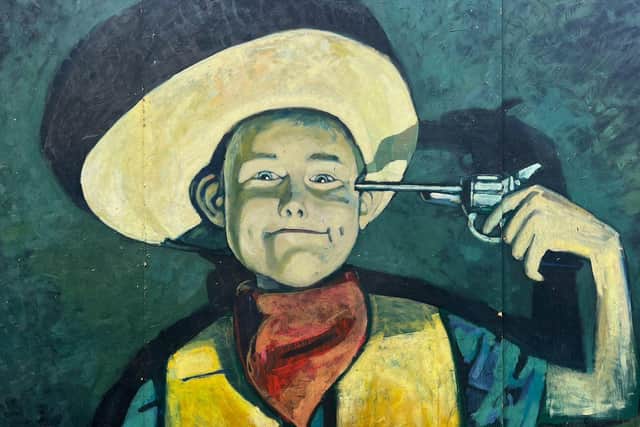 The Stand Comedy Club replaced its painting of a cowboy with a toy gun following complaints that it was offensive.