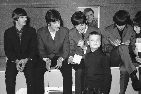 A young fan meets the Beatles at the ABC cinema in Edinburgh in 1964. From left to right: Ringo Starr, John Lennon, Paul McCartney, George Harrison.