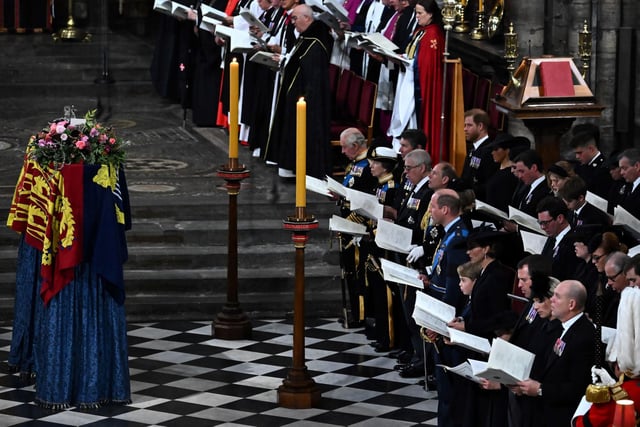 The coffin of Queen Elizabeth II, draped in a Royal Standard and adorned with the Imperial State Crown and the Sovereign's orb and sceptre lying at her State Funeral. Ben Stansall/PA Wire