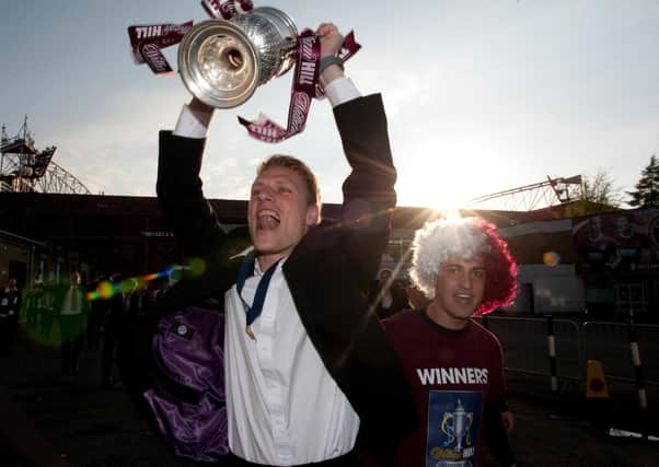 Marius Zaliukas holds up the Scottish Cup alongside Rudi Skacel after Hearts' famous win over Hibs in 2012. Picture: SNS