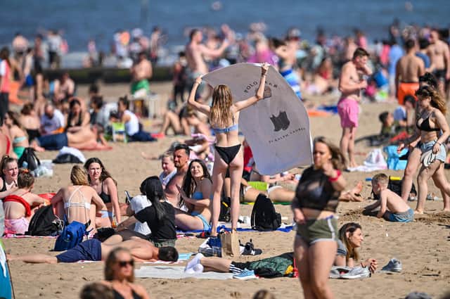 High temperatures have brought large numbers of people to the beach  Photo: Getty images