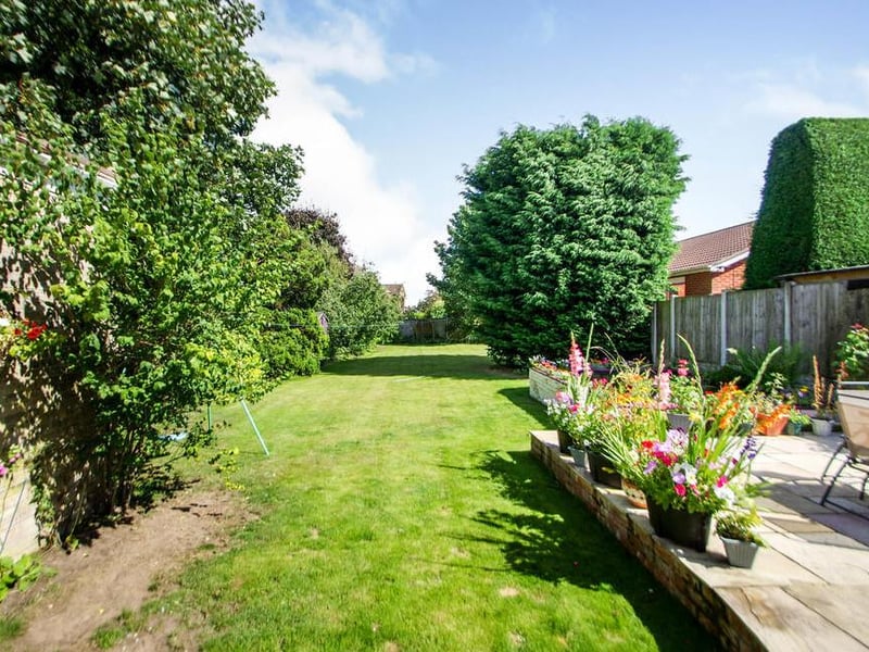 Yet more to see of the beautiful garden. Here at the back is a patio with seating area, ideal for those long, warm summer evenings.
