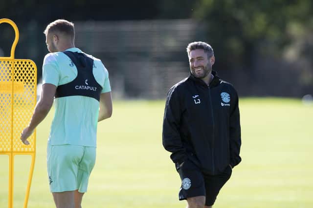 Lee Johnson shares a joke with Porteous during training at East Mains