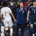 Andrew Robertson in possession for Scotland during the 2-0 win over Armenia as manager Steve Clarke watches on. Picture: SNS