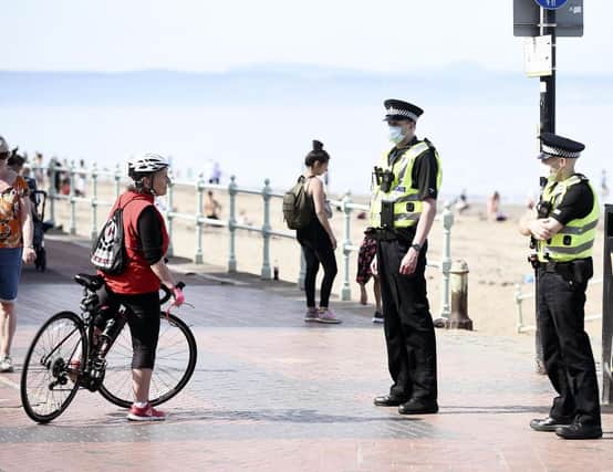 Officers at Portobello Beach police the lockdown rules.