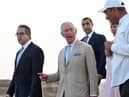 Britain's Prince Charles and Camilla, Duchess of Cornwall, are pictured during a visit to the Giza Pyramids plateau on the western outskirts of the Egyptian capital Cairo on November 18, 2021.