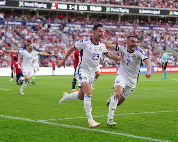 John McGinn and Kenny McLean wheel away to celebrate the latter's winner in Norway on Saturday. Picture: Zac Goodwin/PA Wire.