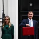 Chancellor Of The Exchequer Jeremy Hunt poses with members of the Treasury staff as he leaves 11 Downing Street to deliver the Budget
