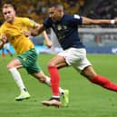 Australia right-back Nathaniel Atkinson chases France left winger Kylian Mbappe during the World Cup Group D match at the Al-Janoub Stadium. Picture: FRANCK FIFE/AFP