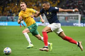 Australia right-back Nathaniel Atkinson chases France left winger Kylian Mbappe during the World Cup Group D match at the Al-Janoub Stadium. Picture: FRANCK FIFE/AFP