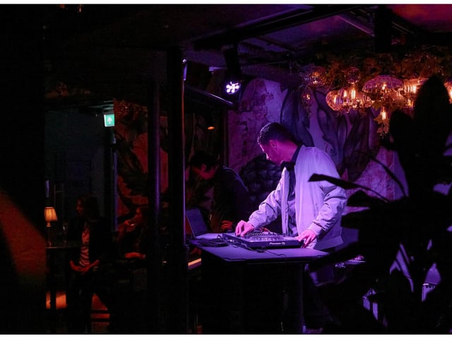 A DJ does his thing on the decks at The Botanist's launch party.