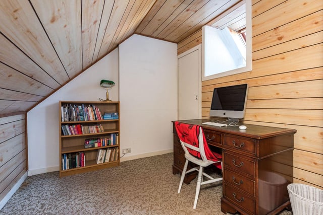 This study, situated in the attic, is the perfect quiet space for home working.