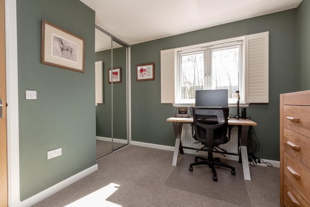 Bright double bedroom 2 to rear with fitted wardrobes, currently used as a dressing room/study, with shutters.