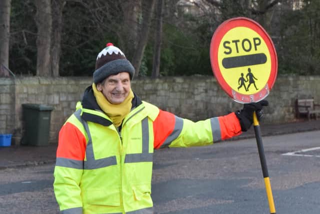 Lollipop man Rob King is hanging up his stick after 15 years at the junction of Colinton Road and Myreside.