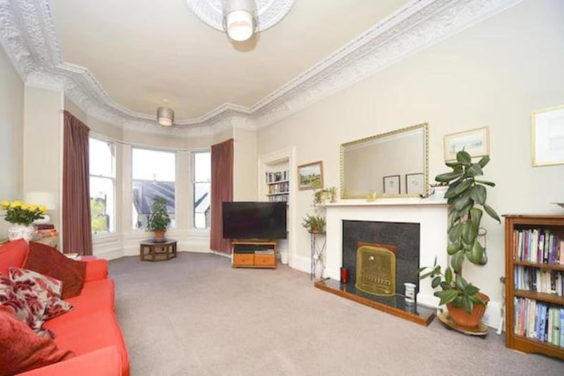 The flat has period features, high ceilings and large windows bringing in a lot of light