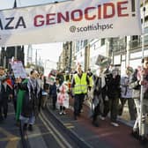 Protesters participate in a Pro-Palestinian march in Edinburgh. The protest, which demands a ceasefire in the Israel-Hamas war and an end to bombing in Gaza, was held on Armistice Day, 105 years since the end of World War I. Photo by Jeff J Mitchell/Getty Images