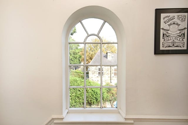 This cheerful window can be found on the landing between the first and second floor.