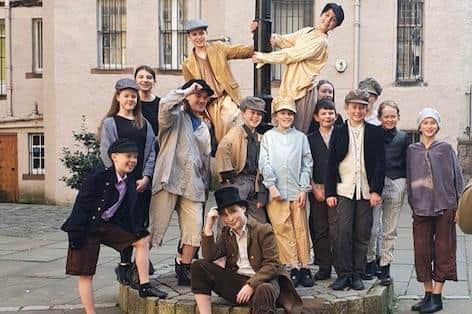 The cast of Forth Children's Theatre's Oliver! in old Edinburgh