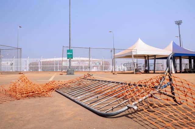 The entrance of Olembe Stadium in Yaounde shows barriers on the ground at the scene of the stampede. Eight people were killed and many more injured in a crush outside ahead of the Africa Cup of Nations match on Monday between the host nation and Comoros.