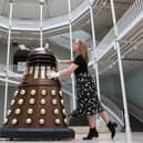 A dalek from Dr Who invades the National Museum of Scotland, helped by staff member Liv Mullen (Picture: Jeff J Mitchell/Getty Images)
