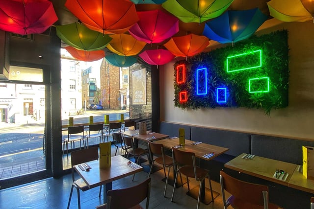The brightly coloured umbrellas hanging from the ceiling light up the new Korean restaurant in Edinburgh.