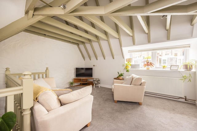The light and airy lounge with beautiful wooden beams.