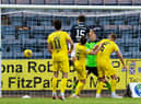 Josh Mulligan heads Dundee back in front against Hibs at Dens Park. Picture: SNS