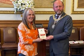 Edinburgh musician Kirsty Baird, pictured receiving her BEM in 2021 at the City Chambers from then Lord Provost Frank Ross, will attend the Coronation of King Charles on Saturday.