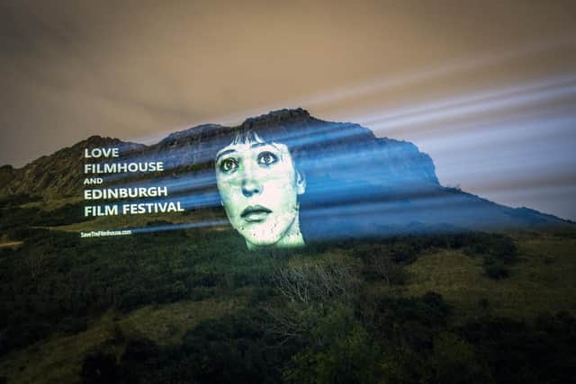An image of actor Anna Karina from the film Vivre Sa Vie was projected on Salisbury Crags in Edinburgh as part of a campaign to save the Edinburgh International Film Festival and the Filmhouse cinema in the city. (Picture: Jane Barlow/PA)