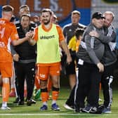 Syngenta boss Gordon Wylde (black cap) and his team enjoy the moment after sealing a place in the Scottish Cup first round for the first time. Picture: Michael Gillen