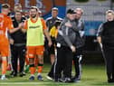 Syngenta boss Gordon Wylde (black cap) and his team enjoy the moment after sealing a place in the Scottish Cup first round for the first time. Picture: Michael Gillen