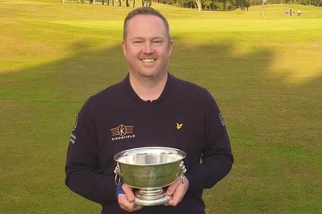 Kingsfield's Allyn Dick shows off the South East District Champinonship trophy after his weekend win at Turnhouse.