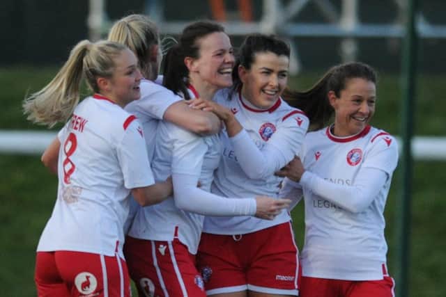 Becky Galbraith celebrates with her Spartans teammates after scoring one of her two goals in the 2-0 win over Hibs last weekend. Picture: Mark Brown