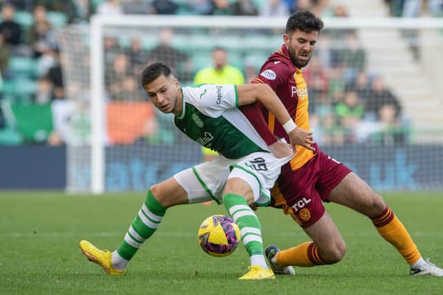 Hibs' Mykola Kukharevych and Sean Goss of Motherwell battle for the ball during the previous cinch Premiership match between the two teams