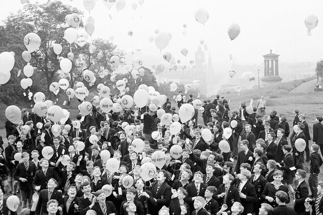 Pupils from the Royal High School release balloons from Calton Hill in aid of Freedom From Hunger Campaign Funds in July 1963.