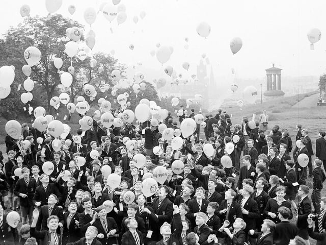 Pupils from the Royal High School release balloons from Calton Hill in aid of Freedom From Hunger Campaign Funds in July 1963.