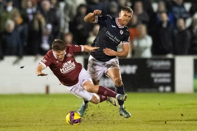 Linlithgow's Sandy Cunningham is fouled by Raith's Tom Lang. Picture: Mark Scates / SNS