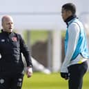 Steven Naismith with Hearts defender Toby Sibbick during training. Picture: SNS
