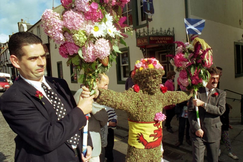 His friends help the Burry Man during his tour of South Queensferry during Ferry Fair 1993.