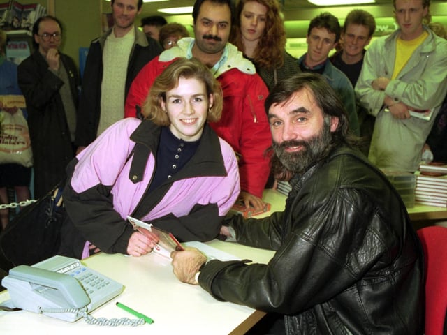 Football legend George Best (with beard), in John Menzies Edinburgh on book signing, promoting his autobiography The Good the Bad and the Bubbly in December 1990. George signs a book for fan Gayle Reynolds.