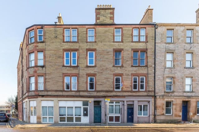 The exterior of the second floor tenement flat, which is in the midst of plenty of shops and eateries, near Leith Shore and two miles from the city centre.